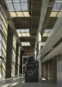 Stairs rising through the central void at the Audiovisual Experimentation Center