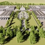 Aerial rendering of a large industrial campus with rows of warehouse-style buildings surrounded by trees