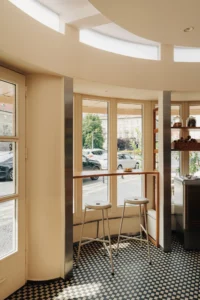Window seating and stools inside Chleboteka Okraglak by CUDO