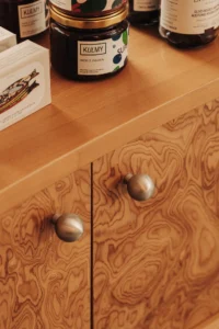 Figured wood veneer and jars at Chleboteka Okraglak by CUDO