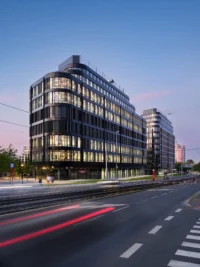 The Hagibor building at dusk, home of CNC and Active Offices by Studio Reaktor