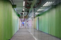 Green corridor between glazed offices at CNC and Active Offices