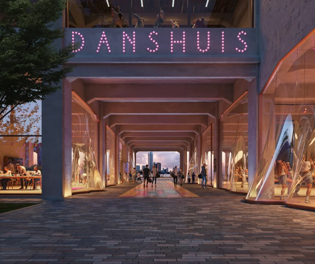 Covered arcade entrance under an illuminated DANSHUIS sign, with cafe tables and curved glass pavilions along the walkway