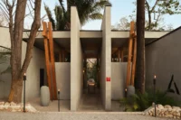The concrete colonnade among the palms, Esh Hotel and Spa
