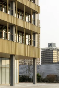 Ferro Offices by GROUP A seen from below, timber floors carried on columns
