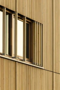 Timber louvers and windows on the bio-based facade of Ferro Offices