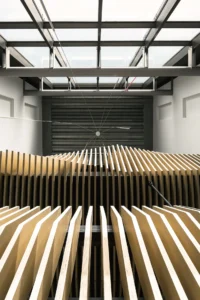 Slatted timber ceiling beneath the atrium skylight at Ferro Offices