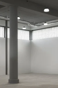 The restored glass block facade seen from inside Ferro Offices by GROUP A