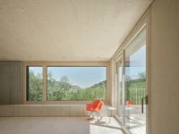 Corner of the living room opening onto the terrace, House on Concrete Walls