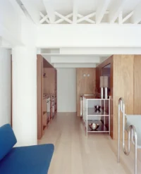Kerr Apartment by SSdH, the open living space under the white factory trusses