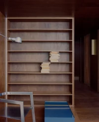 Plywood shelving in the living space at Kerr Apartment by SSdH