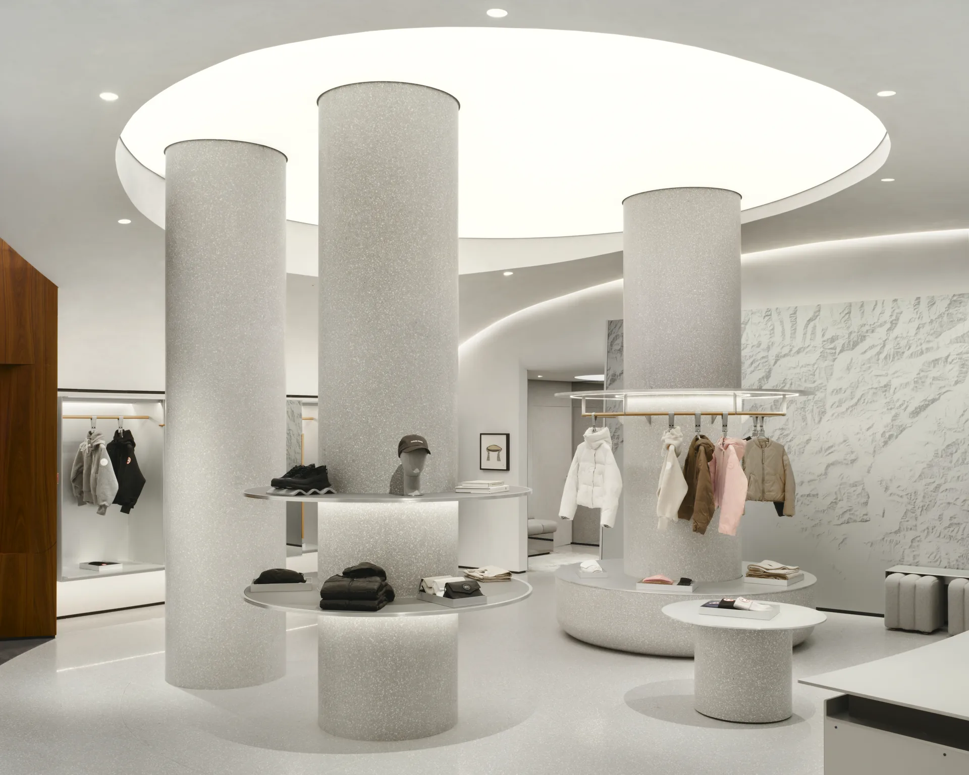 Main sales floor with terrazzo columns under a circular recess in the ceiling