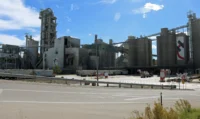 Holcim cement plant at Portland, Colorado, with its kiln and storage silos under an open sky