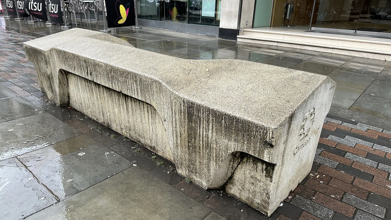 Hostile architecture example: the sloped concrete Camden bench on Great Queen Street, Holborn, London