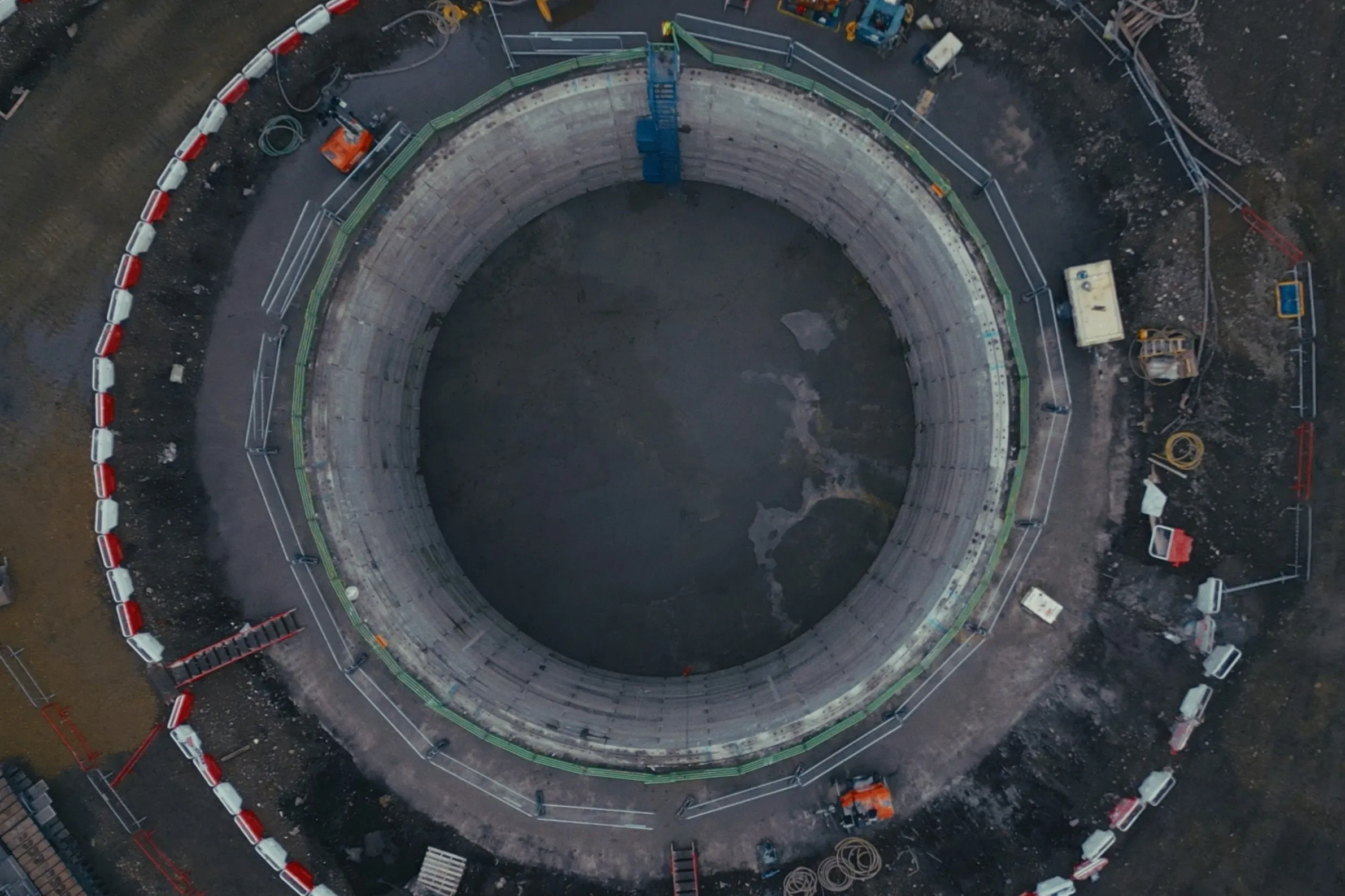 Aerial view of the same circular construction site from a slightly different angle