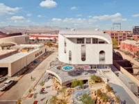 Aerial view of the museum and its landscaped plaza among the surrounding blocks