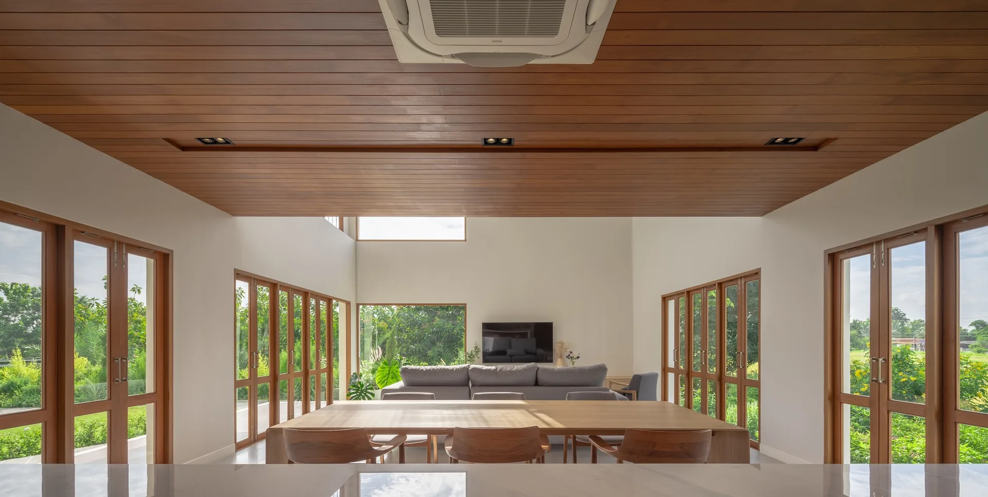 Living and dining under the timber ceiling at PIN'N PAN House