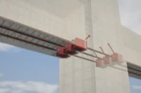 3D rendering of a beam-column joint with red steel connectors and reinforcing bars against a faint building outline