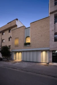 The lit street front of Nafas-e-No Clinic by Event Office