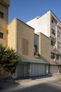 The brick front of Nafas-e-No Clinic behind its street tree