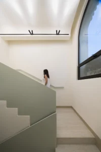 The green balustrade and arched window at Nafas-e-No Clinic