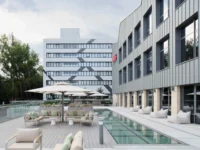 Terrace and water feature beside Narxoz University Business School by AGP Architects