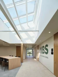 Top-lit corridor at Narxoz University Business School by AGP Architects