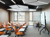 Classroom with orange seating at Narxoz University Business School