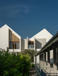 The courtyard between the wings of PIN'N PAN House by ForX Design Studio