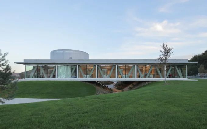 Production and Office Building Dubrovcan by MVA, its horizontal disk resting on three mounds