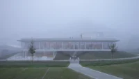 The approach path to Production and Office Building Dubrovcan in fog
