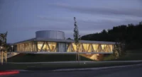 Production and Office Building Dubrovcan by MVA seen from the road at dusk