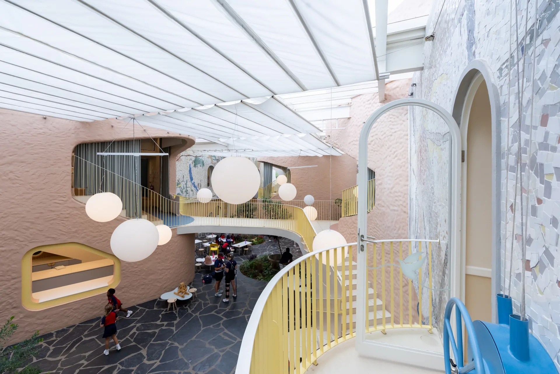 Slide and pendant globes in the Piazza of Redhill Early Learning Centre
