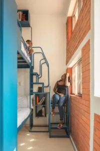 Bunk beds in a shared room at UCAD Dakar Student Housing by Hardel Le Bihan Architectes