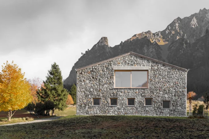 Vergalderie by Christian Tonko, its stone gable against the Montafon peaks in autumn
