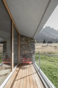 Sheltered terrace under the roof overhang at Vergalderie by Christian Tonko
