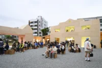 Residents gathered in the courtyard of Wooden Wonders by MVRDV