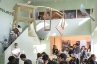 Timber objects hung in the exhibition at Wooden Wonders by MVRDV
