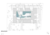 Site plan showing the house around a central courtyard among the trees