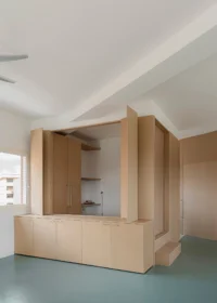 Hinged MDF panels folded open to reveal shelving above a run of low cupboards, Aguacate Space by ALE Estudio