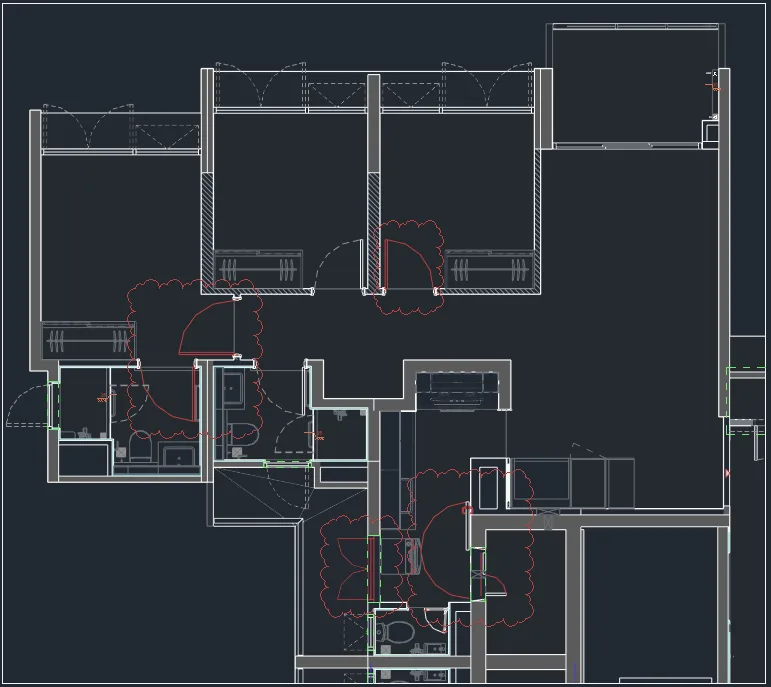Dark Revit floor plan of an apartment with several doors circled by red revision clouds