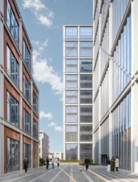 Narrow pedestrian street between a bronze block and a glass block framing the tower in the distance, Greentown ThinkWorks