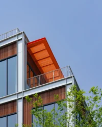 Close view of a bronze roof louvre projecting from a terrace corner, Greentown ThinkWorks