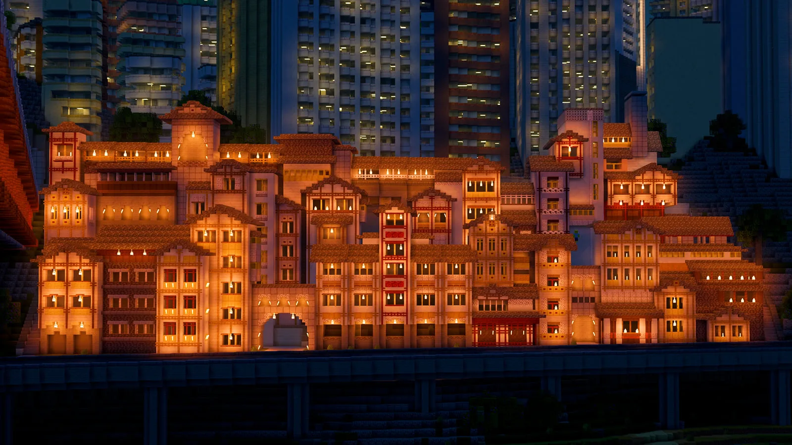 Illuminated stilted building complex in Minecraft at night with high-rise towers behind