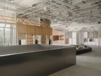 Steel edged slab opening on the upper floor with timber and white metal house frames beyond, Housing CARNIVAL by Studio Profile