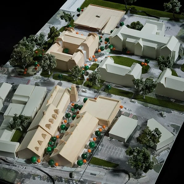 Bird's eye view of a neighborhood site model with houses, trees and roads