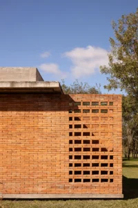 Brick wall with a stepped pattern of open joints under the roof edge