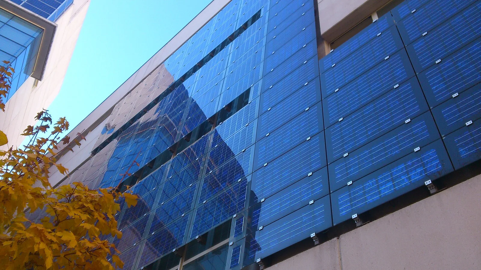 Building applied photovoltaic panels covering the facade of a municipal social services centre in Madrid