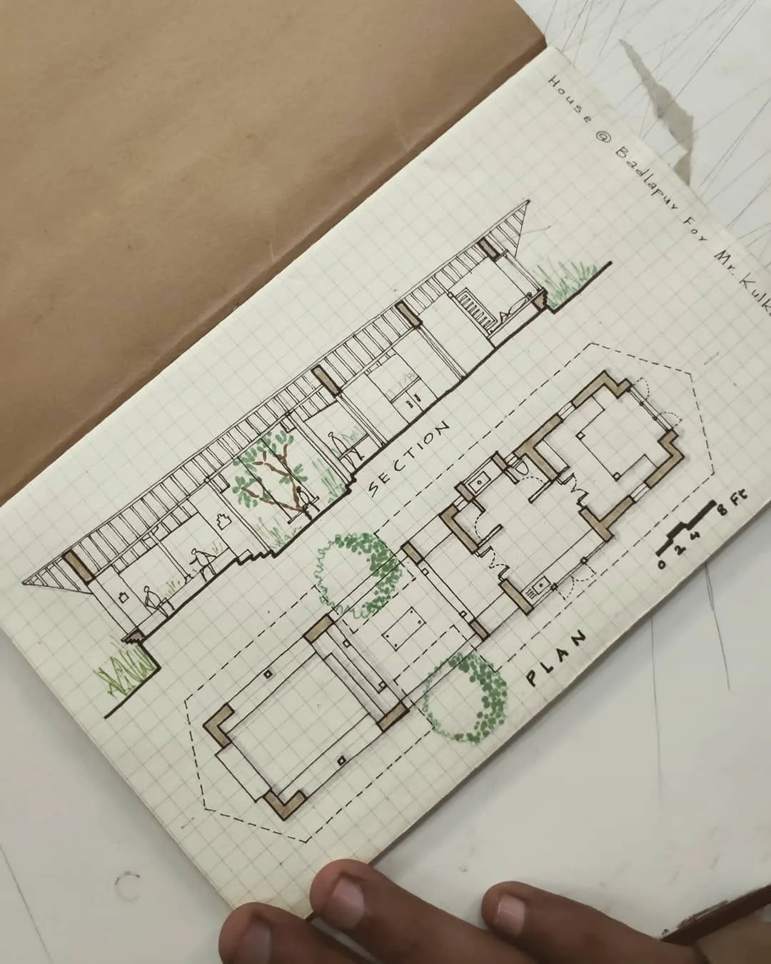 Sketchbook page with a labeled house plan and section drawn to a scale bar