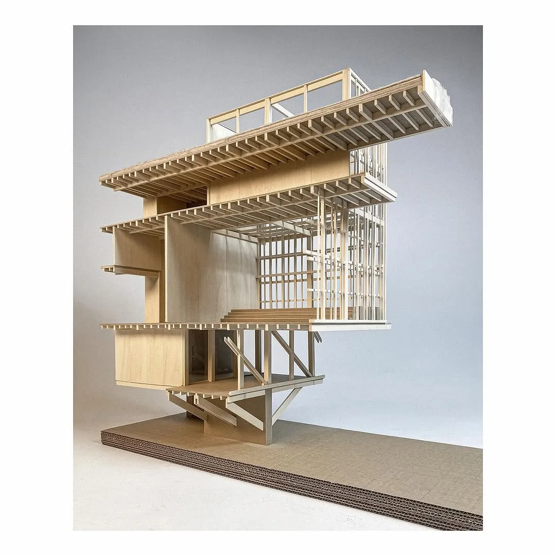 Wooden section model from a second year studio exposing structural framing and a cantilevered terrace